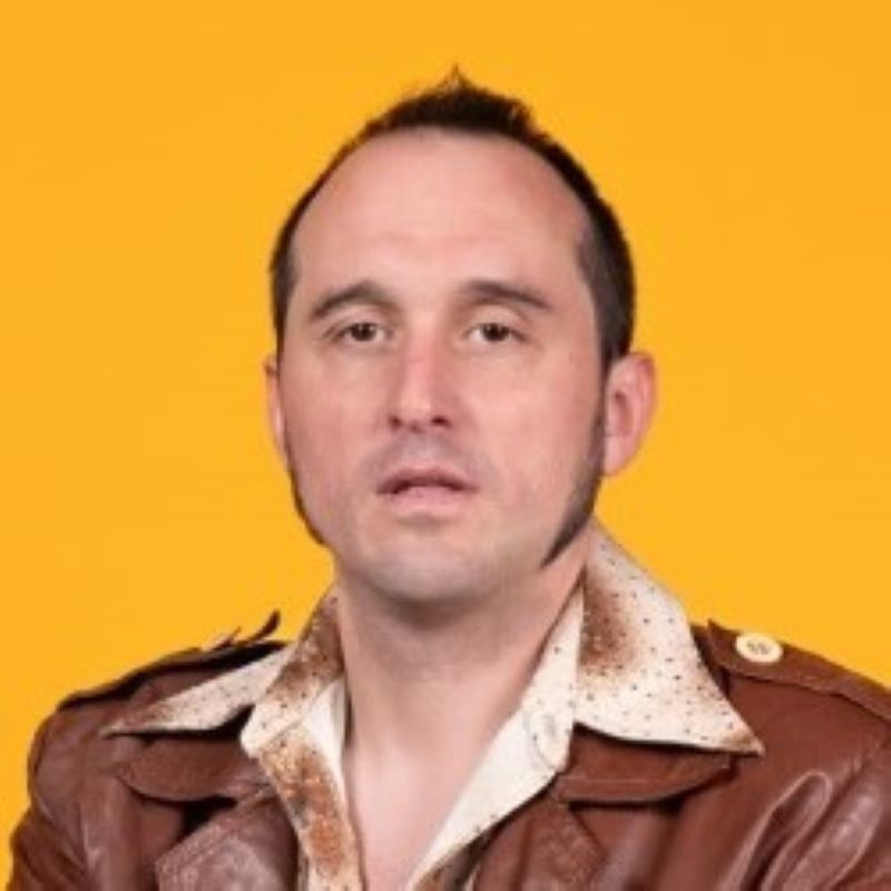 Comedy Genius in a Brown Leather Jacket 